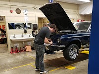 North High Schoool student Kaden Gorges works on his 1967 Mustang