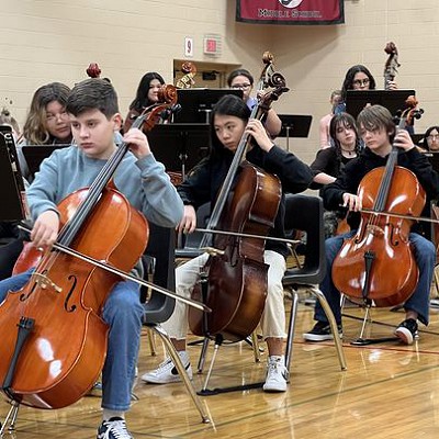 students playing cellos