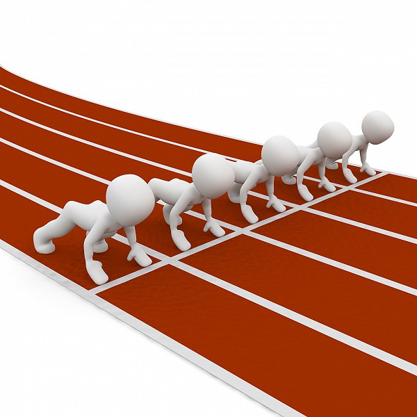 figures lined up at starting line of track