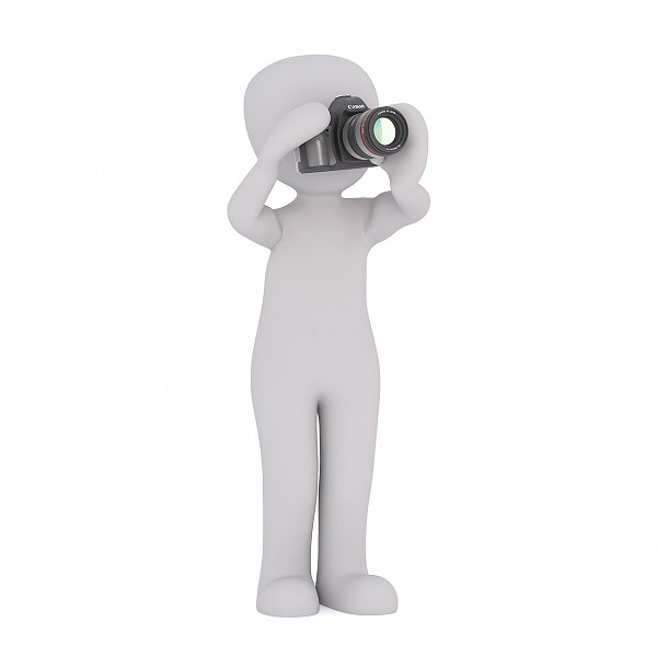 figure holding camera in shooting position