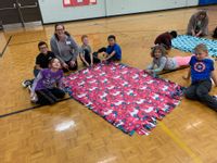 Sheboygan Area School District Lincoln-Erdman Elementary School. Students at Lincoln-Erdman Elementary School working on tie blankets.