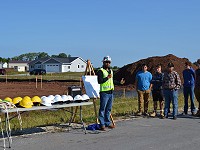 Brian Sippel speaks at house project groundbreaking ceremony.