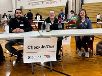 Kohler Credit Union helping to check in students at event