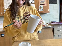 South High student glazing mug