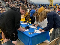 North High School students sign their letters of intent to Lakeland University.