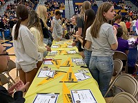North High School students planning to attend UW-Milwaukee take in the Signing Day Event around them.
