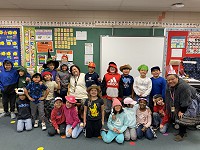 Happy students in a Longfellow Elementary School classroom.