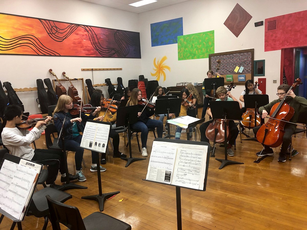 Orchestra students practice for a concert