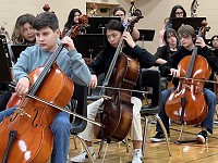 students playing cellos