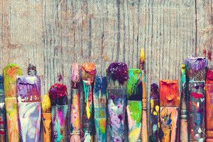 Paint filled paint brushes